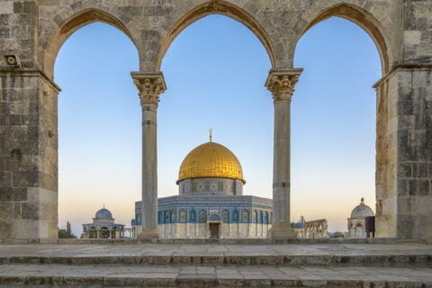 Dome of the Rock in Jerusalem seen through arches