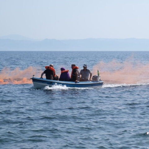 Photo of boat with migrants at sea during simulation exercise in Lesvos, Greece
