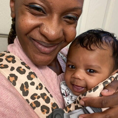 Eboni Tomasek hugs her healthy infant son, Ezekiel, courtesy of Eboni Tomasek.