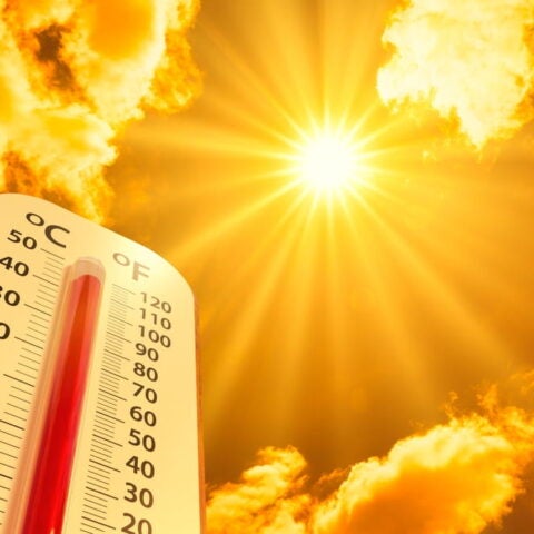 hermometer on yellow sky with sun shining in summer show higher Weather, concept global warming_photo by Lamyai_Shutterstockl