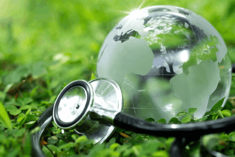 Crystal Earth with a medical doctor's stethoscope on green grass. chayanuphol / Shutterstock