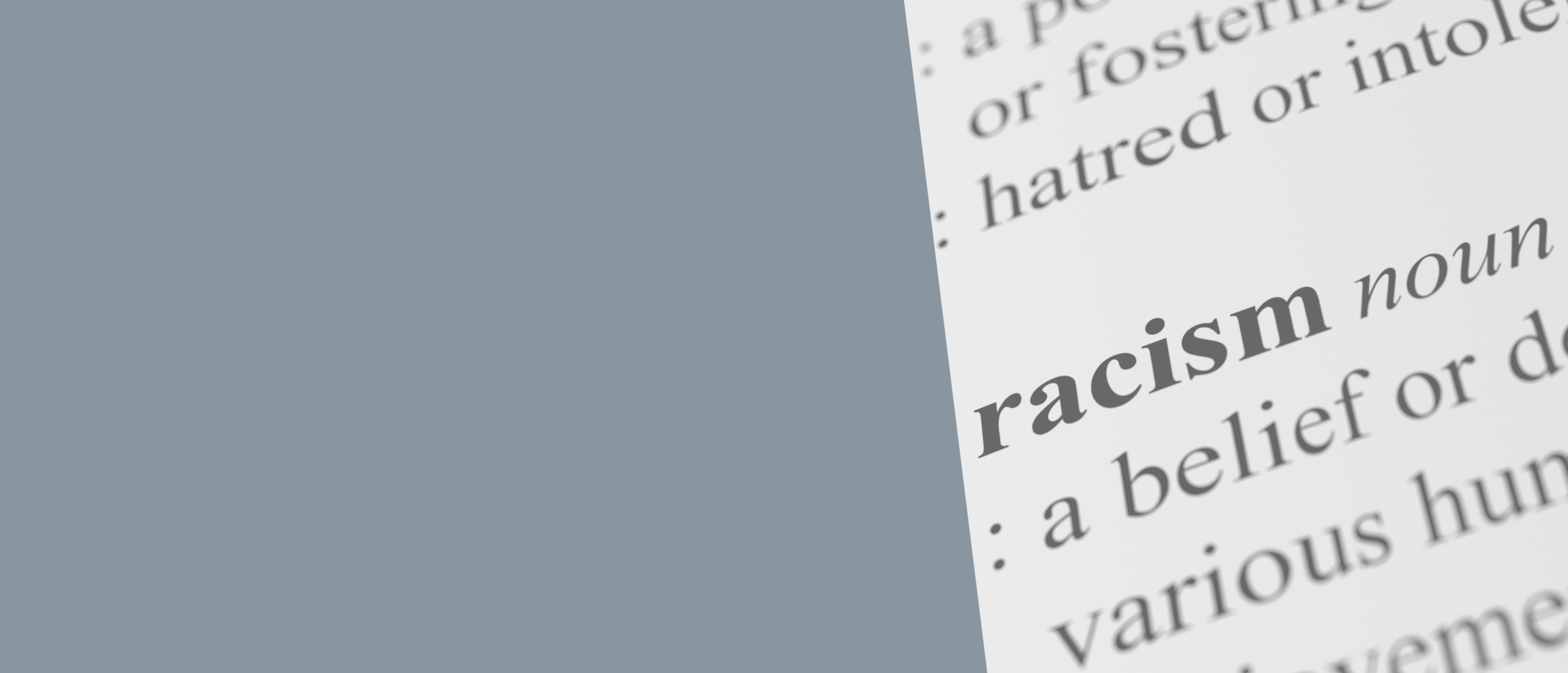 Close up of dictionary page showing the definition of the word racism.
