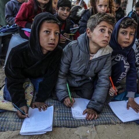 Palestinian children, whose education was suspended when Israeli bombardments destroyed their schools, continued their lessons in makeshift tents with volunteer teachers in Khan Younis, Gaza. Photograph: Abed Rahim Khatib / Anadolu/Getty Images