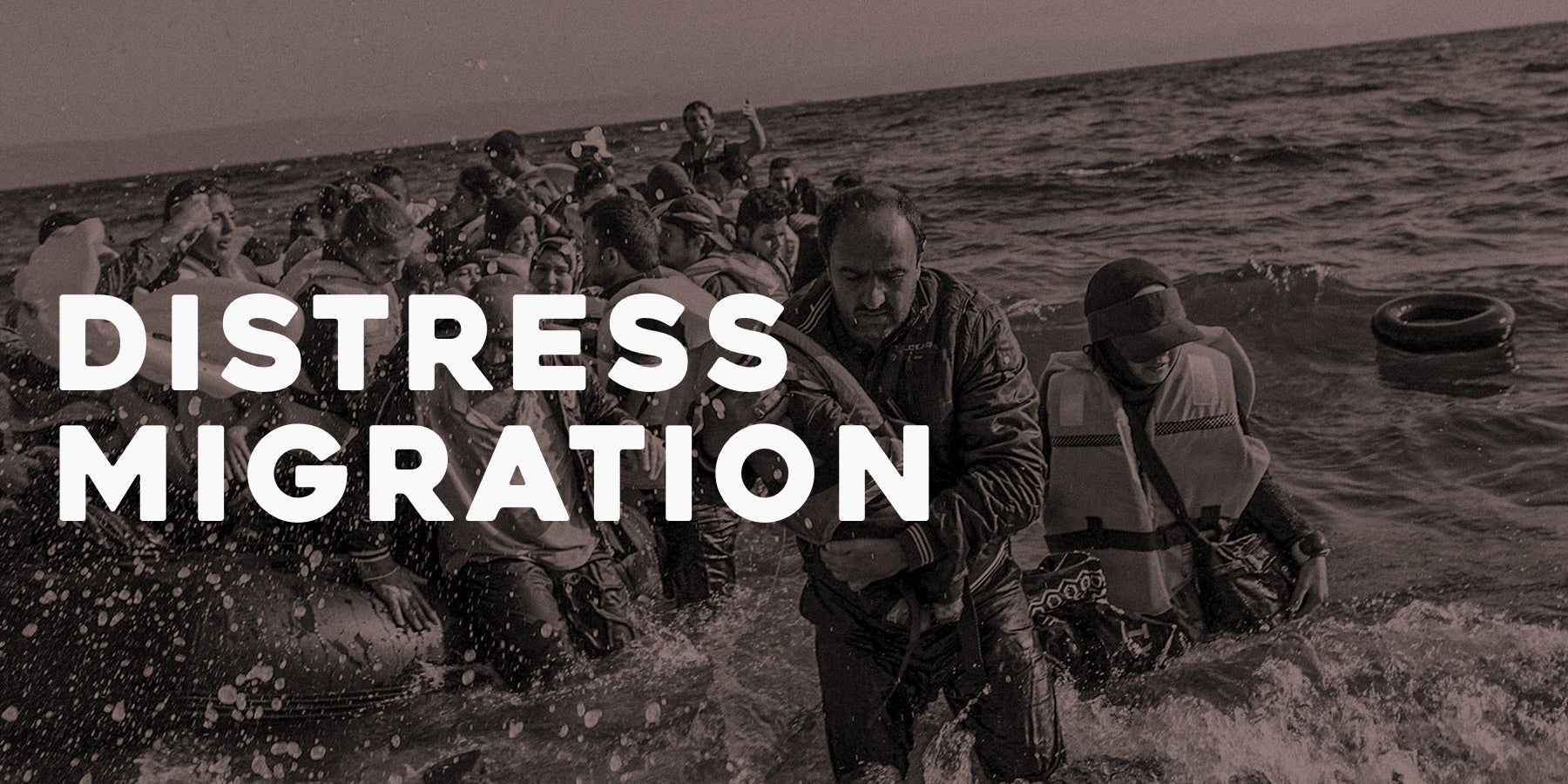 The text "Distress Migration" against a black and white image of migrants coming out of the sea in life vests.