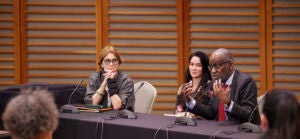 Jacqueline Bhabha, Alexandra Oprea, and David Williams speaking at the 11th Roma Conference on April 6, 2023.