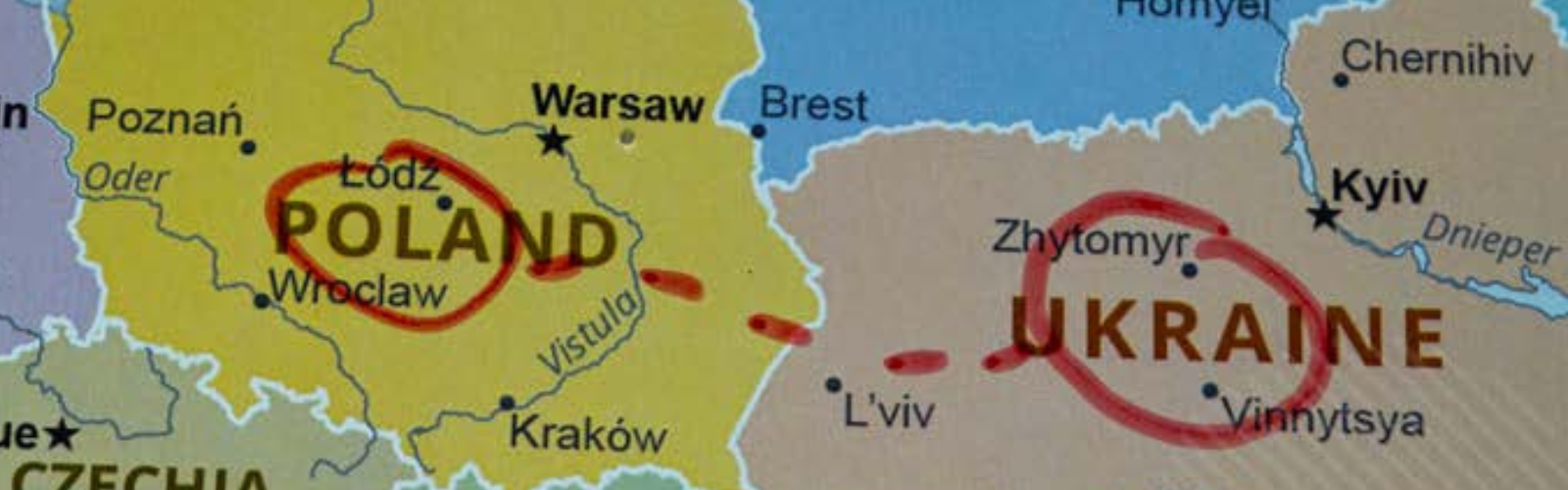 Map of Eastern Europe showing Poland and Ukraine. Poland and Ukraine country names circled in red marker and connected by red dotted line.