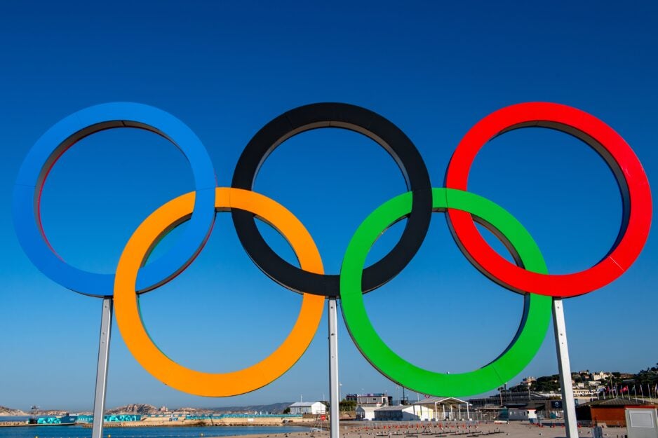 Marseille, France, July 26, 2024: The Paris 2024 Olympic rings in Marseille's Olympic marina for the sailing and water sports events. Photo credit: Obatala Photography / Shutterstock.